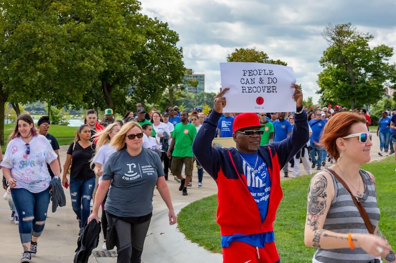 People marching for recovery.