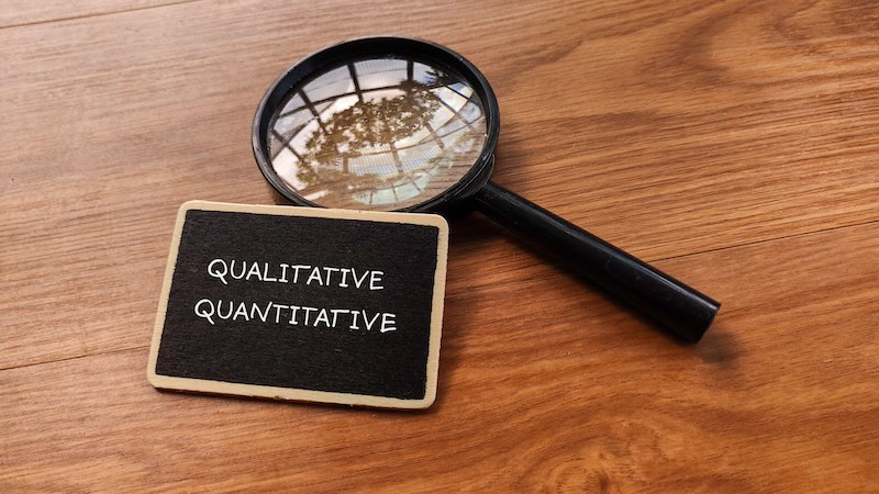 Magnifying glass w/ qualitative / quantitative.